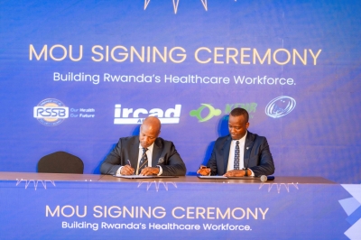 King Kayondo, President of IRCAD Africa and Regis Rugemanshuro, the CEO of RSSB sign the agreement in Kigali.