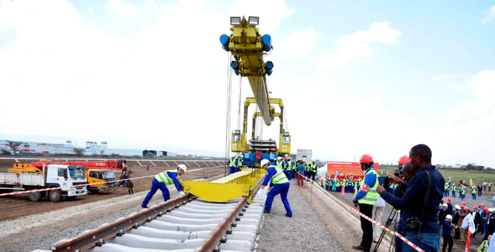 Workers laying tracks for the Standard Gauge Railway Phase 2A at Suswa section in Narok, Kenya 6 stations on August 1, 2018