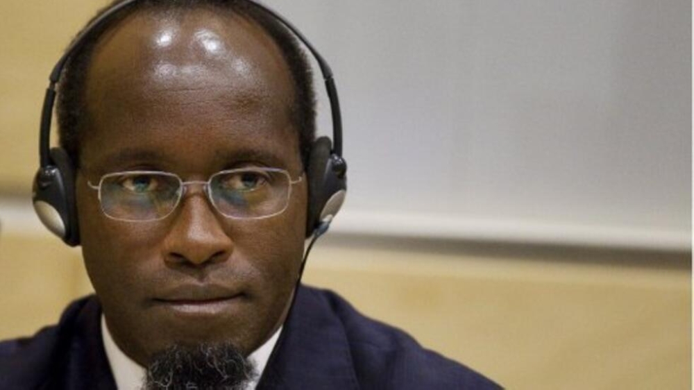 Genocidal militia leader Callixte Mbarushimana looks on at the opening of the confirmation of charges hearing at the International Criminal Court (ICC) in The Hague on September 15, 2011.   A hearing to confirm war crimes and crimes against humanity charges against Rwandan rebel leader Callixte Mbarushimana, committed in 2009 against Congolese citizens opened at the International Criminal Court. AFP PHOTO/ANP/Jerry Lampen -  netherlands out - belgium out