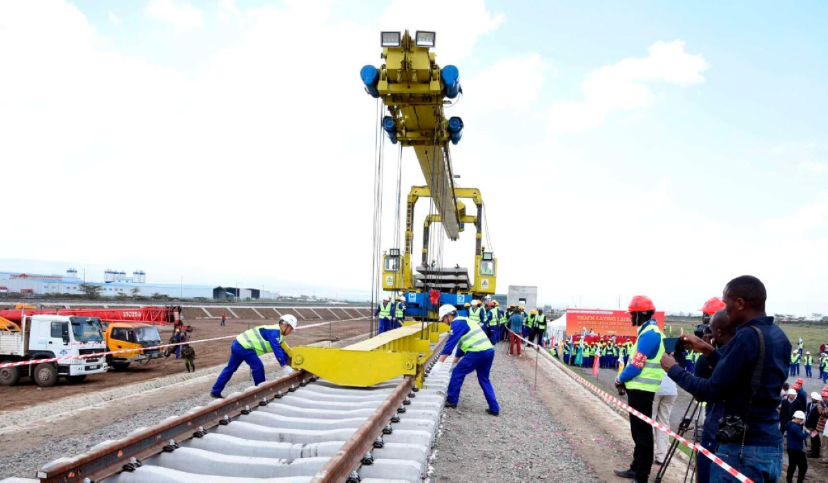 Workers laying tracks for the Standard Gauge Railway Phase 2A at Suswa section in Narok, Kenya 6 stations on August 1, 2018