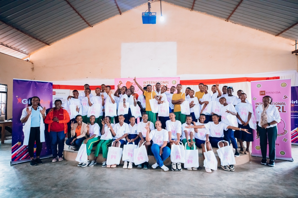 AIDS Healthcare Foundation (AHF) delegates pose with students of  Groupe Scolaire Kagugu Catholique (GS Kagugu) during the International Day of the Girl Child (IDG)  held on October 11. Photos by Craish Bahizi 