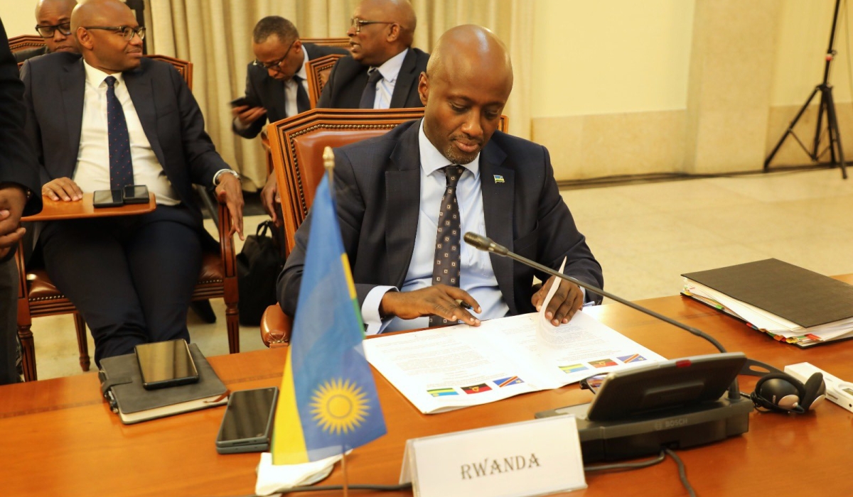 Foreign Affairs Minister Olivier Nduhungirehe signs the agreement during the fifth ministerial meeting on the peace and security eastern DR Congo,  in Angola on October 12. Courtesy