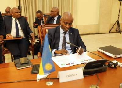 Foreign Affairs Minister Olivier Nduhungirehe signs the agreement during the fifth ministerial meeting on the peace and security eastern DR Congo,  in Angola on October 12. Courtesy