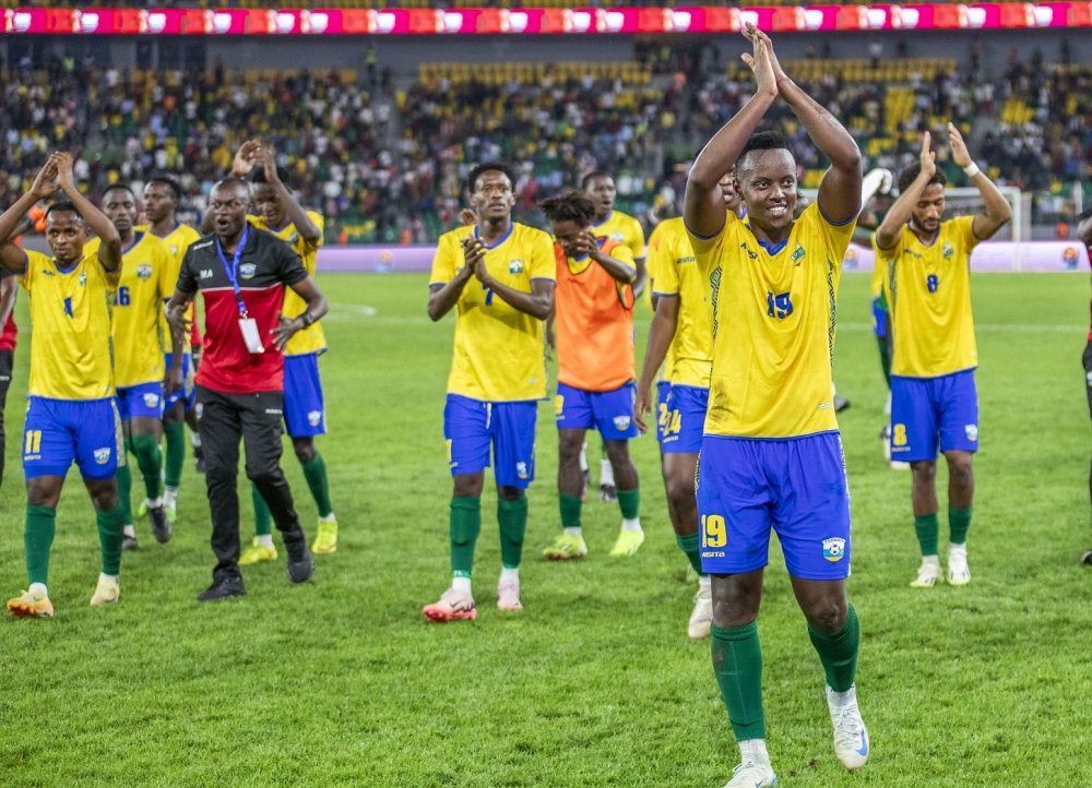 Goal scorer Innocent Nshuti leads his teammates as they thank supporters after beating Benin 2-1 at Amahoro stadium. Photos by Emmanuel Dushimimana