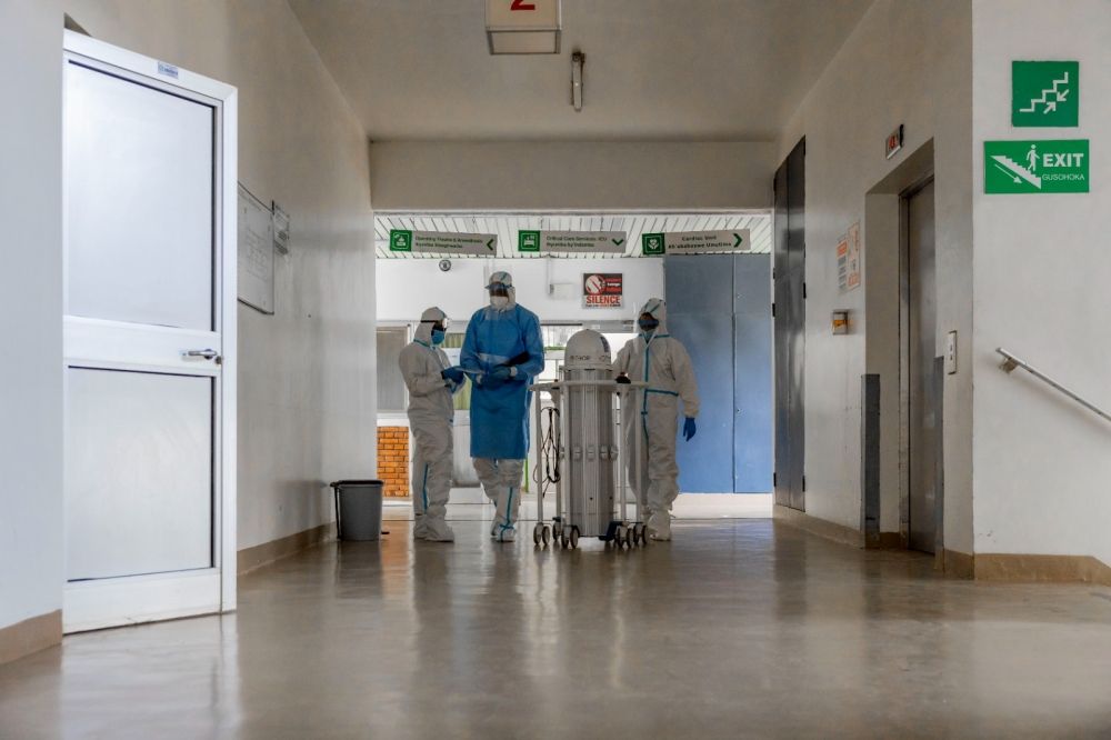 An Infection Prevention and Control (IPC) team before performing a decontamination procedure using an ultraviolet laser robot at a hospital in Kigali earlier this month, as part of ongoing response to the Marburg outbreak. Photo: Courtesy.