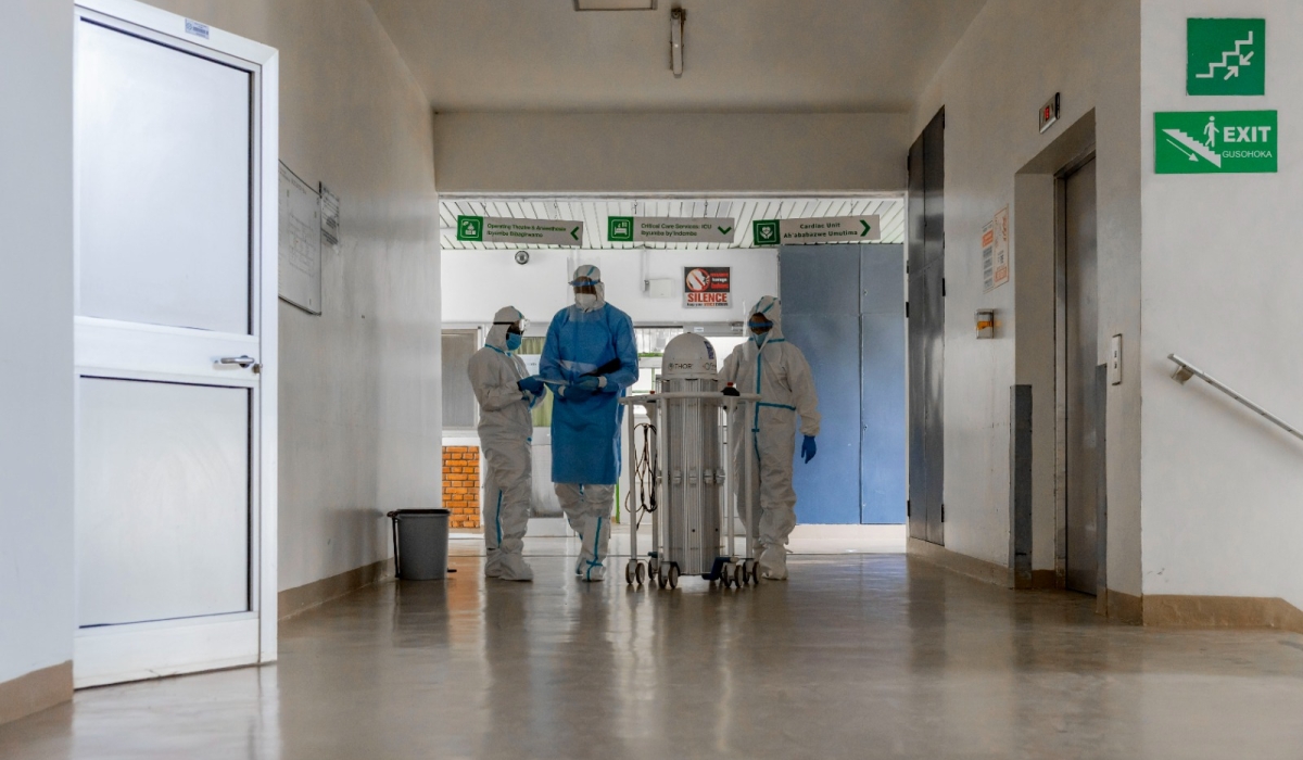 An Infection Prevention and Control (IPC) team before performing a decontamination procedure using an ultraviolet laser robot at a hospital in Kigali earlier this month, as part of ongoing response to the Marburg outbreak. Photo: Courtesy.