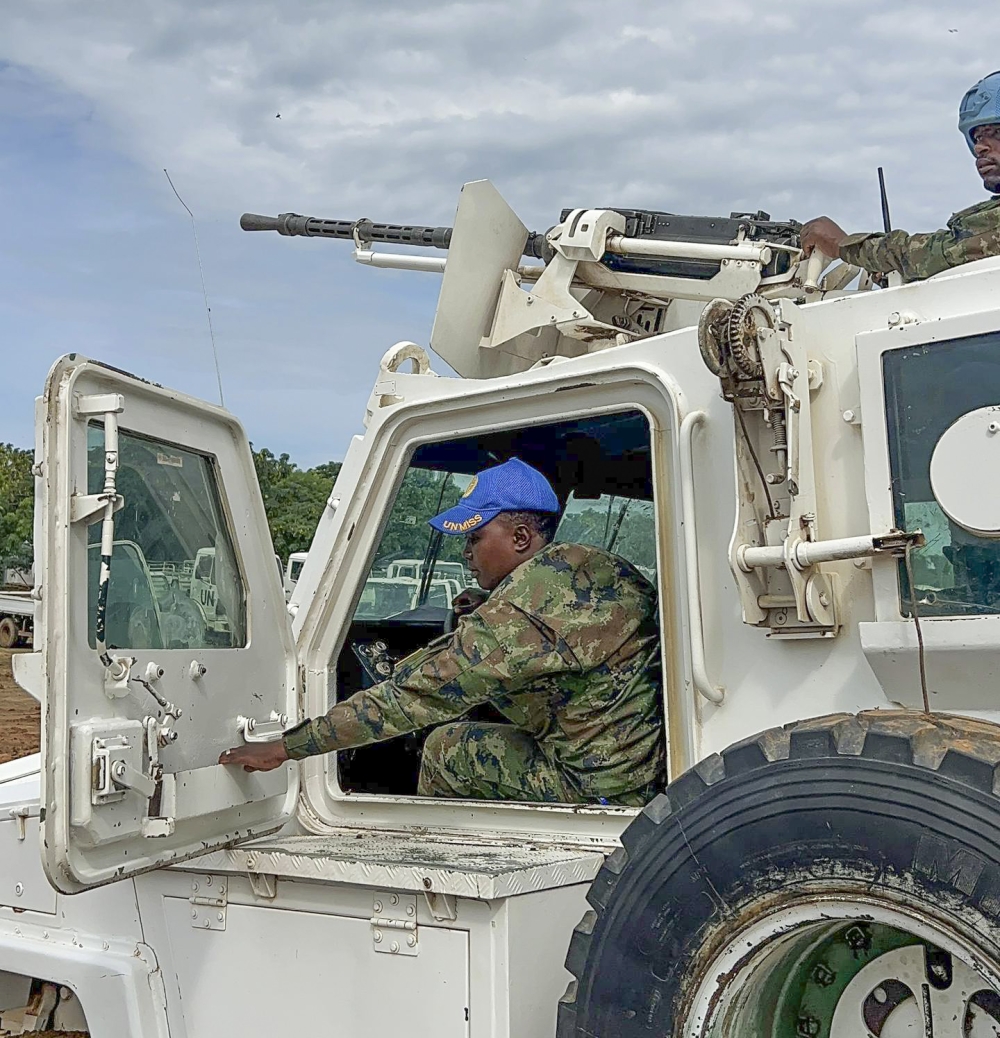 Corporal Sandrine Iradukunda has been a soldier for 10 years. She is among the few female soldiers operating an armoured personnel carrier (APC), a military vehicle designed to transport personnel and equipment in combat zones. Photos by Davis Higiro