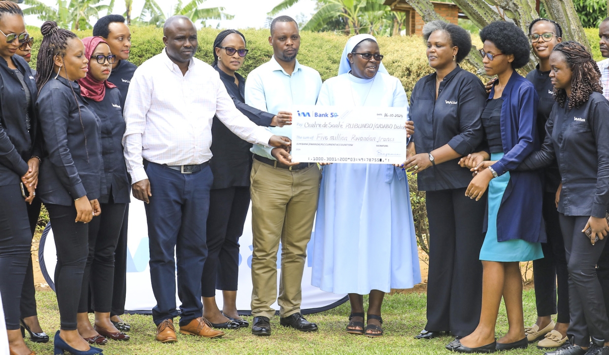 I&M Bank Rwanda Plc staff hands over their support to Rubungo Health Centre  to support malnourished children in Kibenga cell, Ndera sector, Gasabo District on October 16. Photos by Craish Bahizi