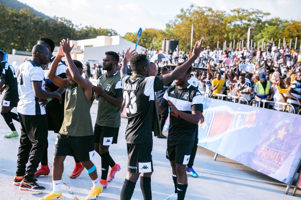 APR FC players and fans celebrate the victory against Rayon Sports at Kigali Pele Stadium on Saturday, March 9. Photo by Craish Bahizi 