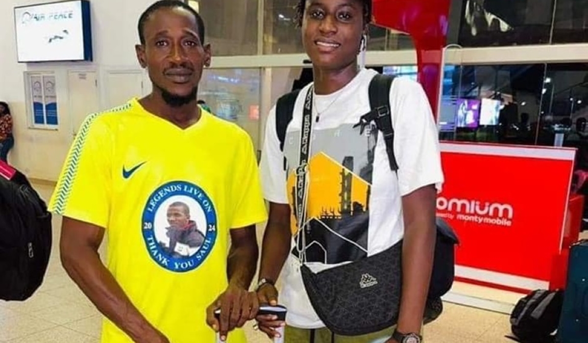 Ceesay (in white) with her manager before she left The Gambia for Kigali. Courtesy.