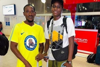 Ceesay (in white) with her manager before she left The Gambia for Kigali. Courtesy.