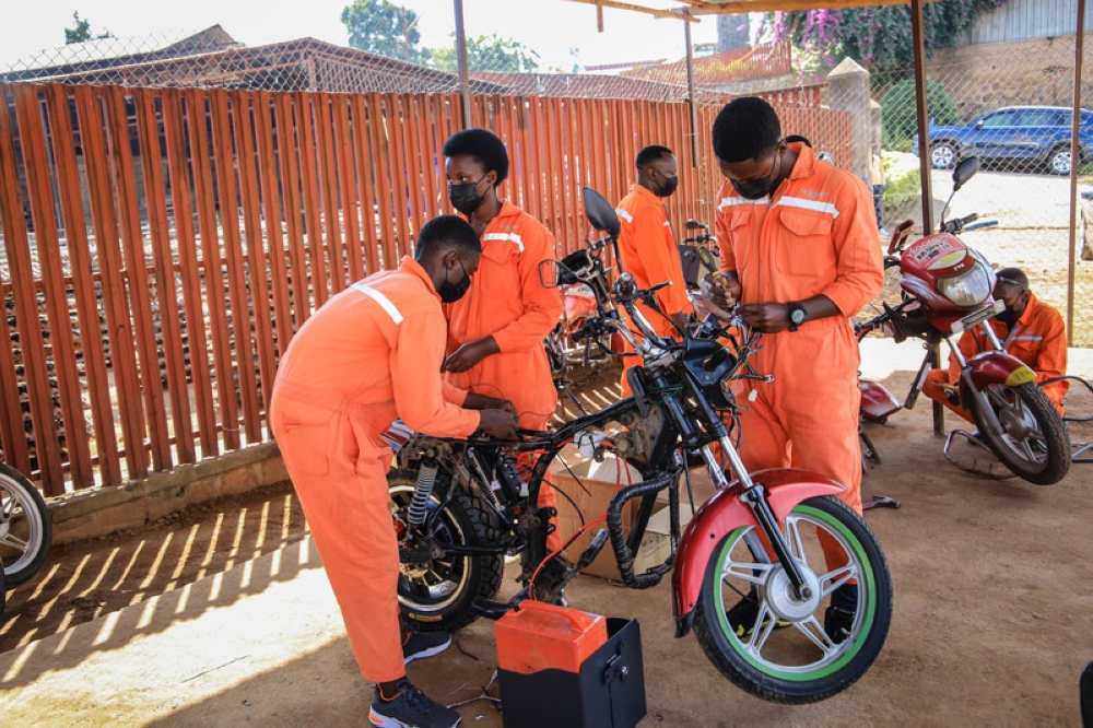 Technicians retrofitting of fossil fuel motorcycles to electric motorcycles at Rwanda Electric Mobility Ltd in Kicukiro district on June 10, 2021.