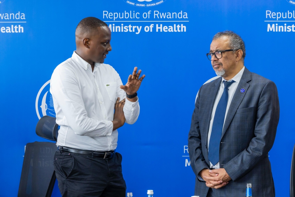 Minister of State for Health Dr Yvan Butera interacts with Director-General of the World Health Organisation (WHO) Dr Tedros Adhanom Ghebreyesus in Kigali on Saturday, October 19. Courtesy