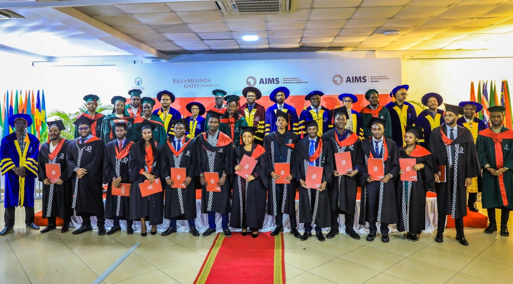 Officials and 14 graduates pose for a group photo at  the graduation at the African Institute for Mathematical Sciences (AIMS) Rwanda on October 18, 2024. Photos by Craish Bahizi