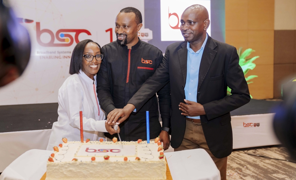 Officials cut a cake during the official launch of Broadband Systems Corporation&#039;s new logo at Kigali Convention Centre. The launch of new logo also marked the celebration of 15 years of operation providing to  Rwandans the use the internet and other related services. Courtesy