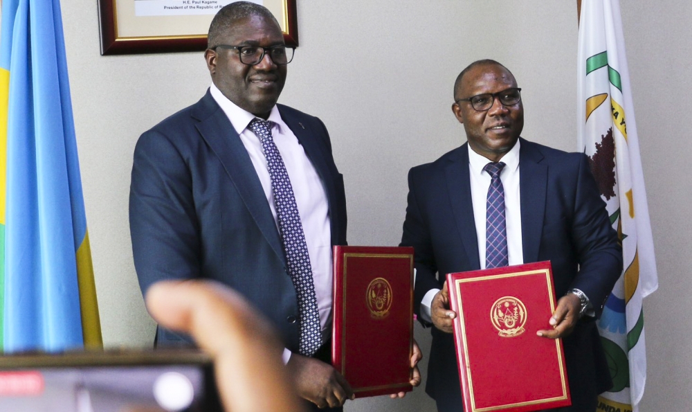 Local Government newly appointed minister, Patrice Mugenzi and the outgoing minister Jean Claude Musabyimana during the handover ceremony on Monday, October 21.Courtesy
