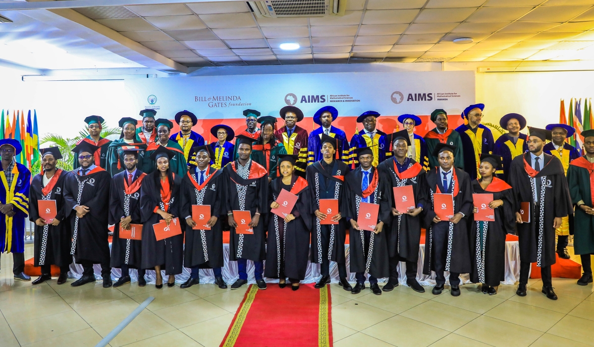 Officials and 14 graduates pose for a group photo at  the graduation at the African Institute for Mathematical Sciences (AIMS) Rwanda on October 18, 2024. Photos by Craish Bahizi