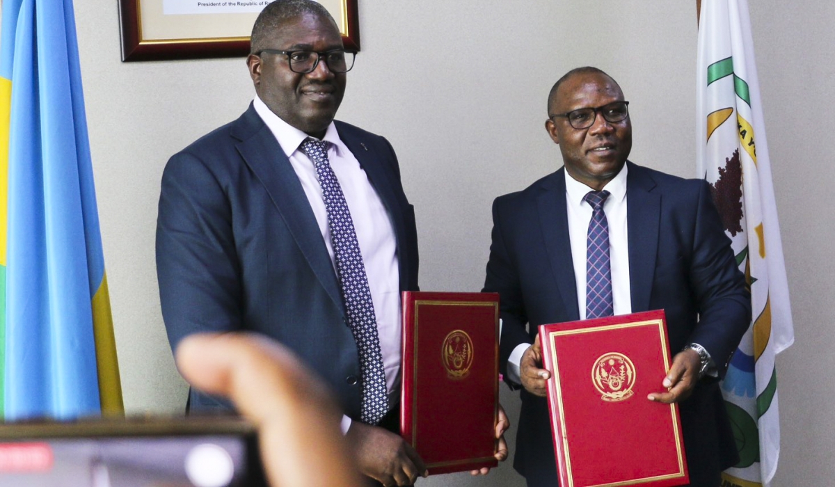 Local Government newly appointed minister, Patrice Mugenzi and the outgoing minister Jean Claude Musabyimana during the handover ceremony on Monday, October 21.Courtesy
