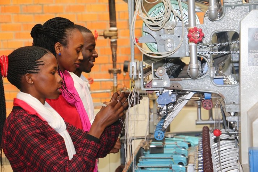 Workers at Kigali Silk Factory before the factory postponed the production. File