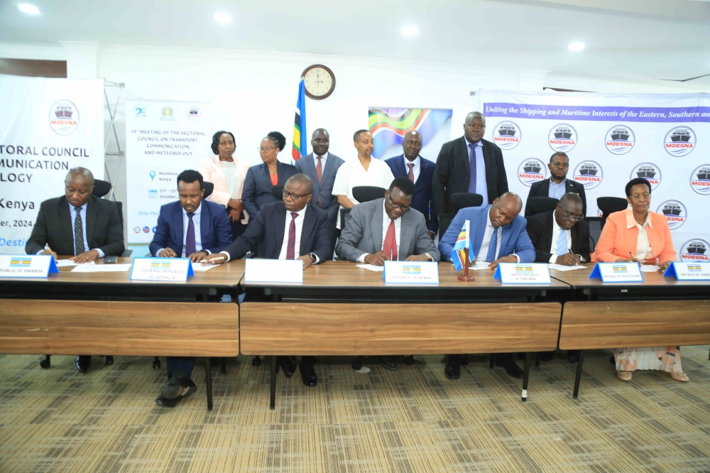 Kenya’s Cabinet Secretary for Roads and Transport, Davis Chirchir, and EAC Partner States Ministers sign the report of the 19th Sectoral Council on Transport, Communications and Meteorology in Mombasa, Kenya. Also in the photos are the EAC Deputy Secretary General in charge of Infrastructure, Productive, Social and Political Sectors, Andrea Aguer Ariik and Partner States’ Permanent/Principal Secretaries.