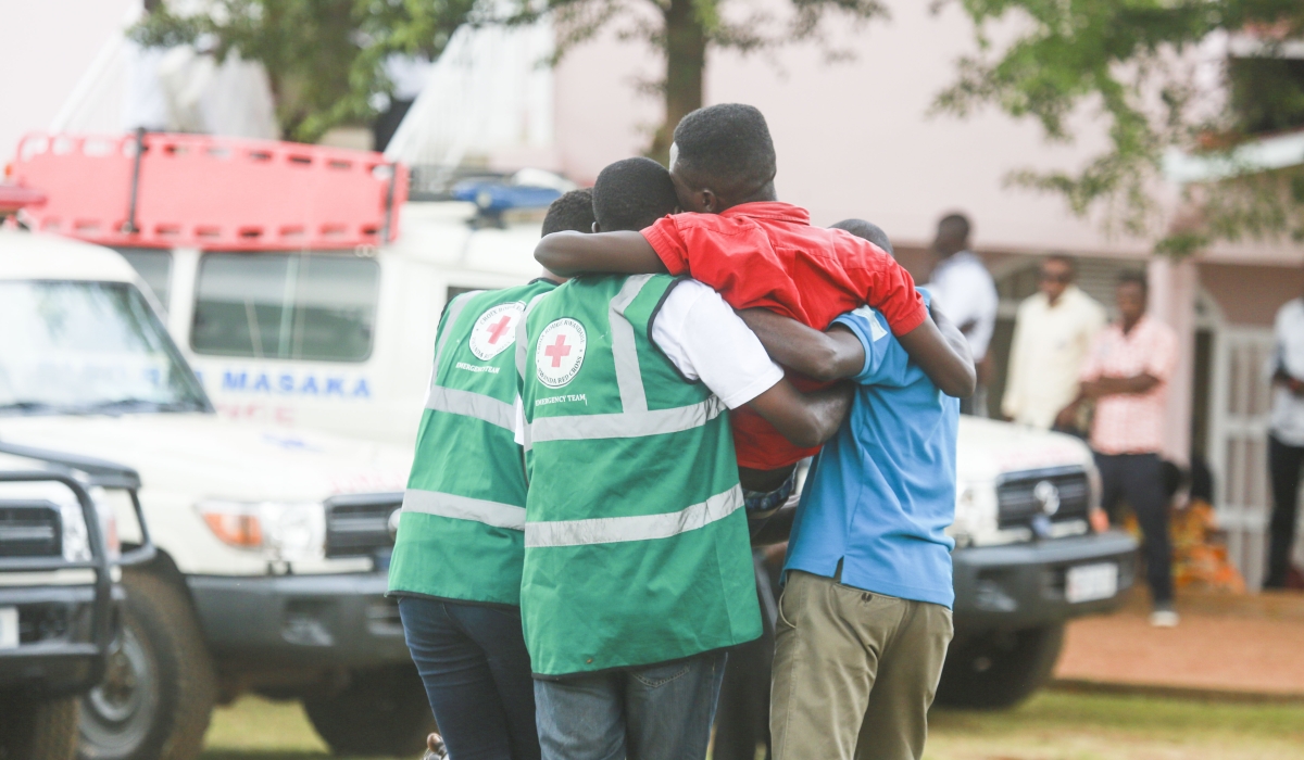 Red Cross volunteers help a trauma victim during a commemoration event at Kicukiro-Nyanza Genocide Memorial in 2019. Sam Ngendahimana