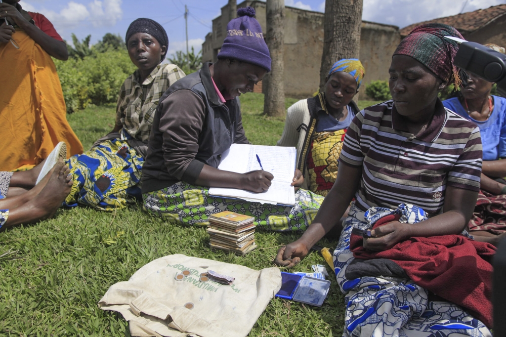 Women in Dufashanye cooperative collect their weekly contribution in their saving scheme in Muko Sector Musanze District. Sam Ngendahimana