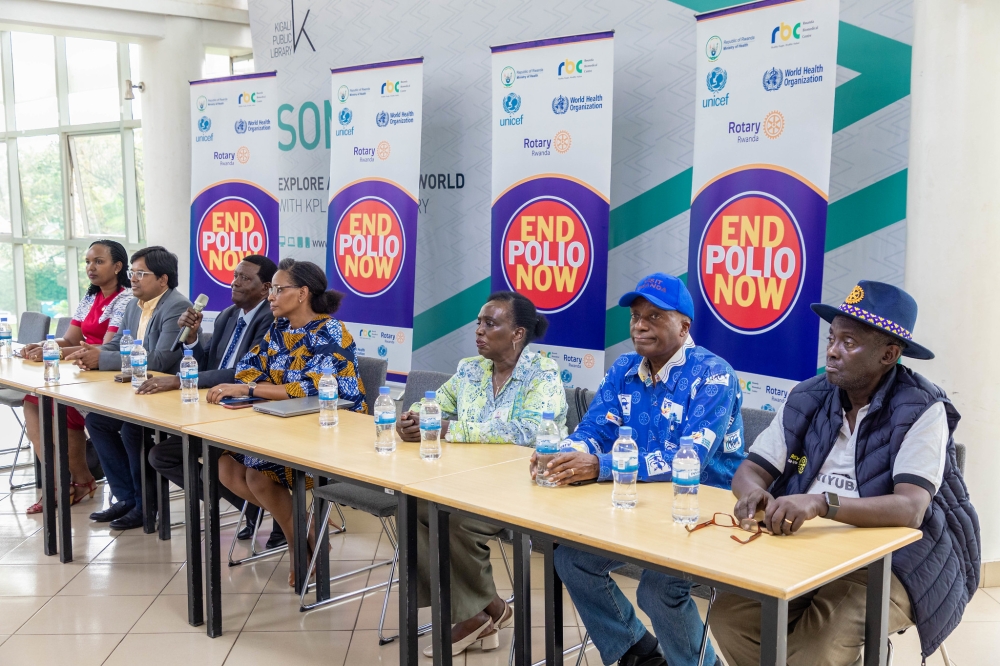 Members of the Club of Kigali Karisimbi, Kigali Virunga, Kigali Cosmopolitan, the Club of Kigali Seniors, and other Rotarians, address media about fighting polio in Rwanda. Craish Bahizi