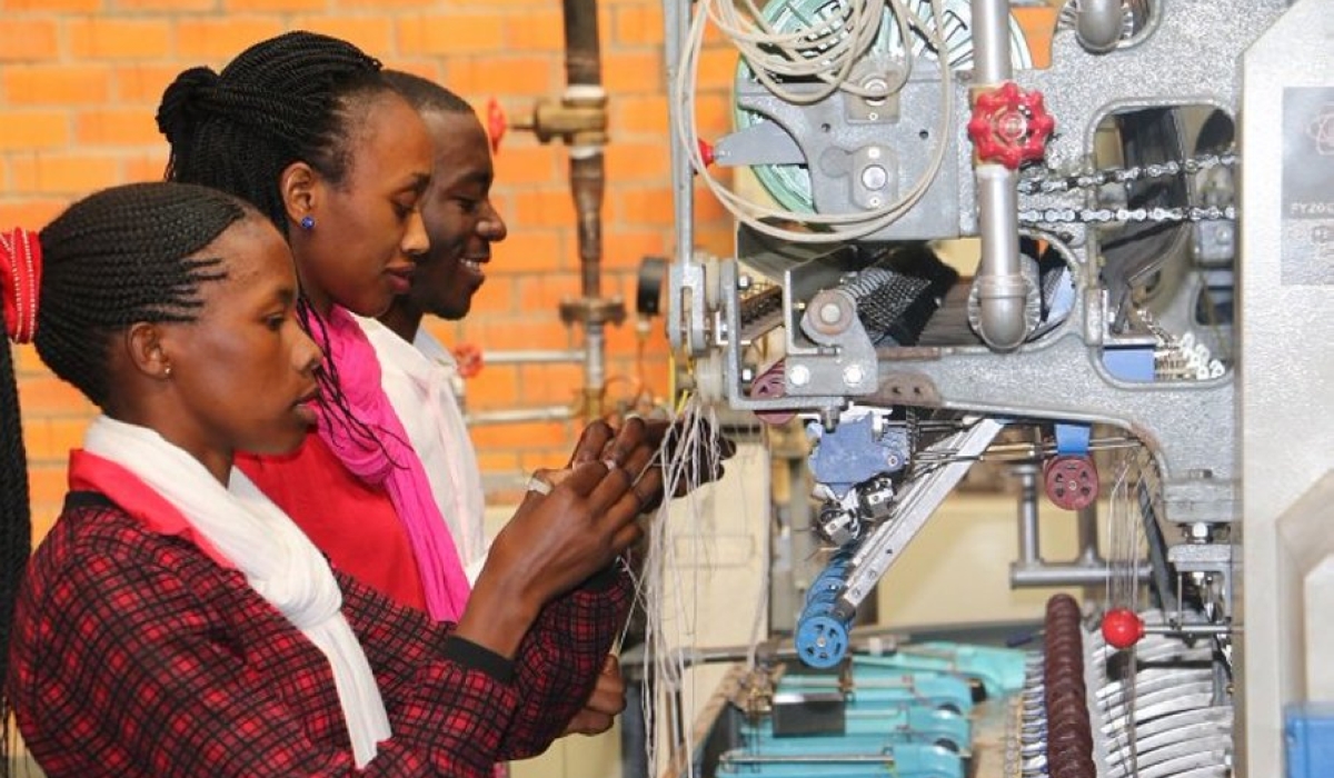 Kigali Silk Factory workers sort silk before the postponment of its operation in Kigali. Courtesy