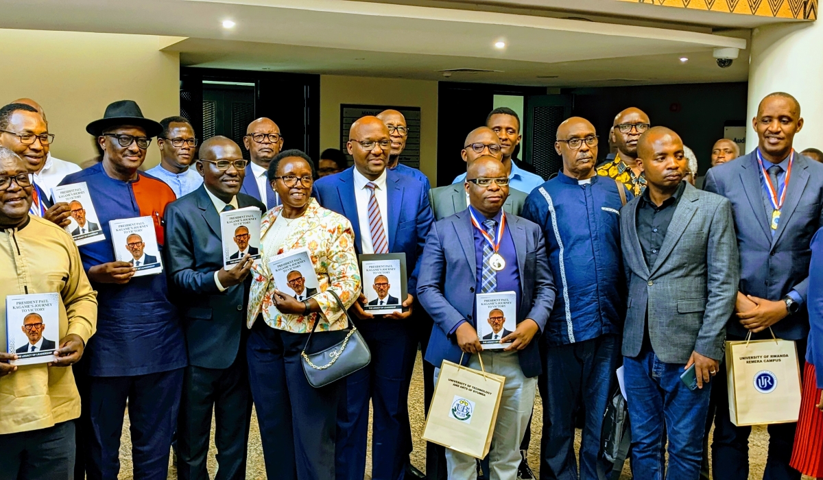 Distinguished figures, including members of the Rwanda Writers Federation, government officials, veteran politicians, and representatives from nearly all universities across Rwanda pose for a group photo after the book launch at the Intare Arena, the headquarters of the Rwanda Patriotic Front-Inkotanyi, on November 1. PHOTOS BY FRANK NTARINDWA