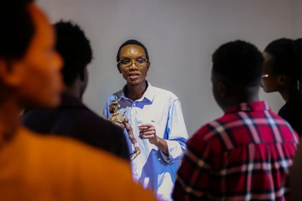 Josue Mugisha, a Rwandan sculpture during "La corrida" exhibition launch at Envision Gallery. Photos by Frank Ntarindwa