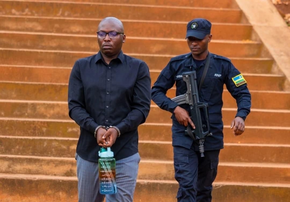 Rwandan showbiz journalist Jean Bosco Sengabo alias Fatakumavuta (L) arrives at Kicukiro Primary Court ahead of the hearing on Tuesday, November 5-courtesy