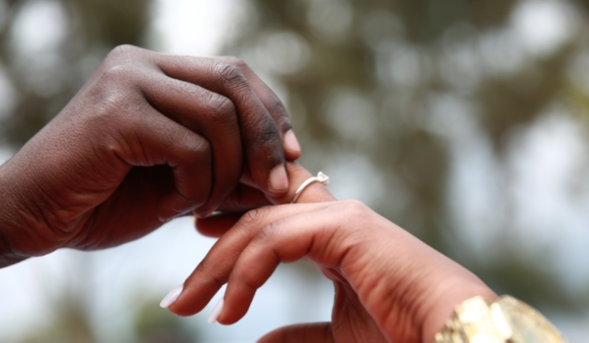 A groom raises the hand of his bride during a wedding ceremony. A new report released by the judiciary shows that divorce cases reduced in 2023/24 compared to previous years. Photo/ Sam Ngendahimana