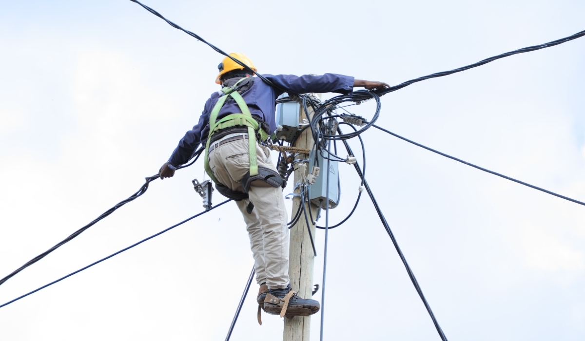 A technician during the electricity supply activities in Gicumbi District.  The government’s aim to achieve 100 percent energy access within five years is admirable. Photo Courtesy 