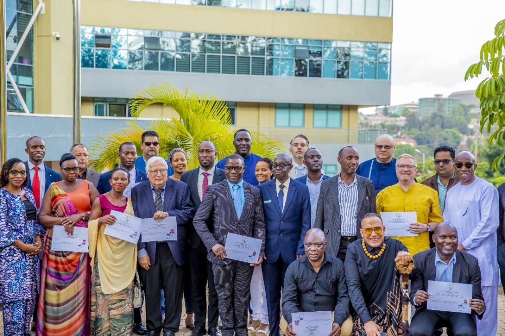 Some individuals granted Rwandan nationality pose for a photo in Gasabo District on November 8, 2024. Many foreigners are opting for Rwandan citizenship due to the country&#039;s economic opportunities, security, strong governance, and more. Photo courtesy