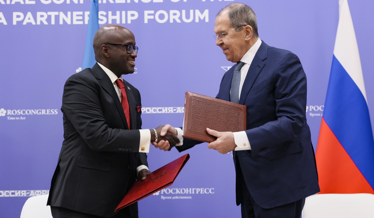 Rwanda&#039;s Minister of Foreign Affairs and International Cooperation, Olivier Nduhungirehe, and his Russian counterpart Sergey Lavrov,  shake hands after signing the visa waiver agreement for holders of service and 