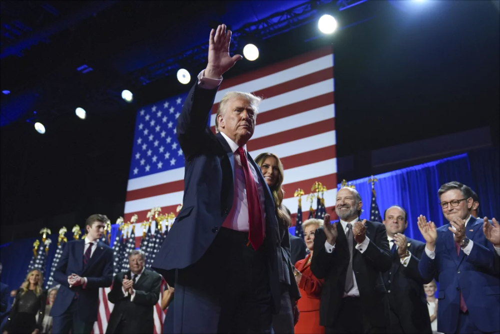 President Donald Trump waves as he walks with Melania Trump at an election night watch party at the Palm Beach Convention Center in West Palm Beach, last week. Analysts believe Trump’s foreign policy will prioritise transactional relationships and shift away from multilateral partnerships. Net photo