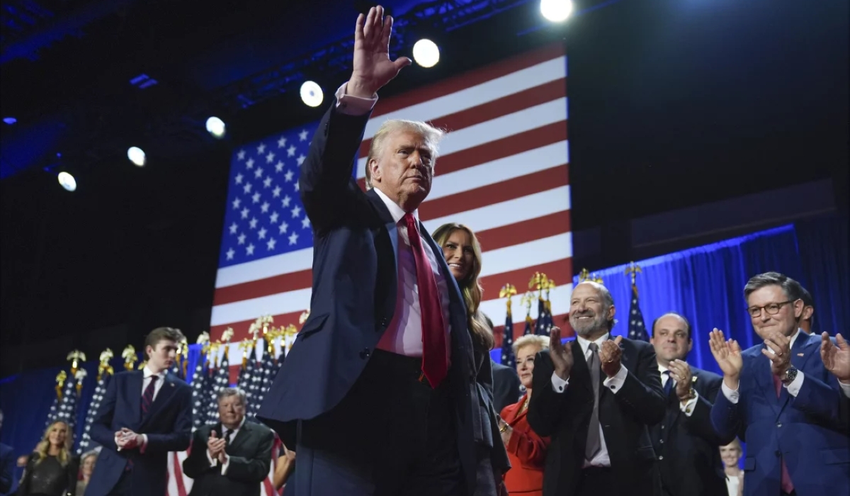 President Donald Trump waves as he walks with Melania Trump at an election night watch party at the Palm Beach Convention Center in West Palm Beach, last week. Analysts believe Trump’s foreign policy will prioritise transactional relationships and shift away from multilateral partnerships. Net photo