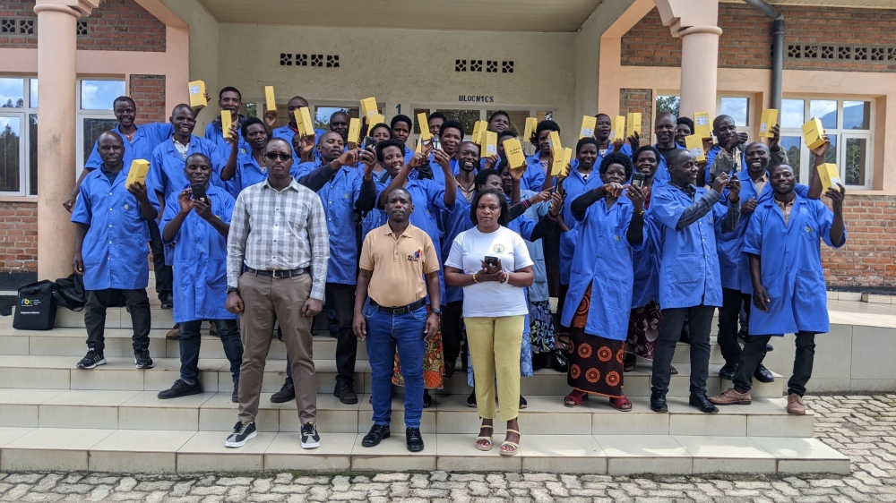  Community health workers in Nyabihu District pose for a group photo after receiving smartphones provided by Health Builders Organisation| Photos By Germain Nsanzimana 