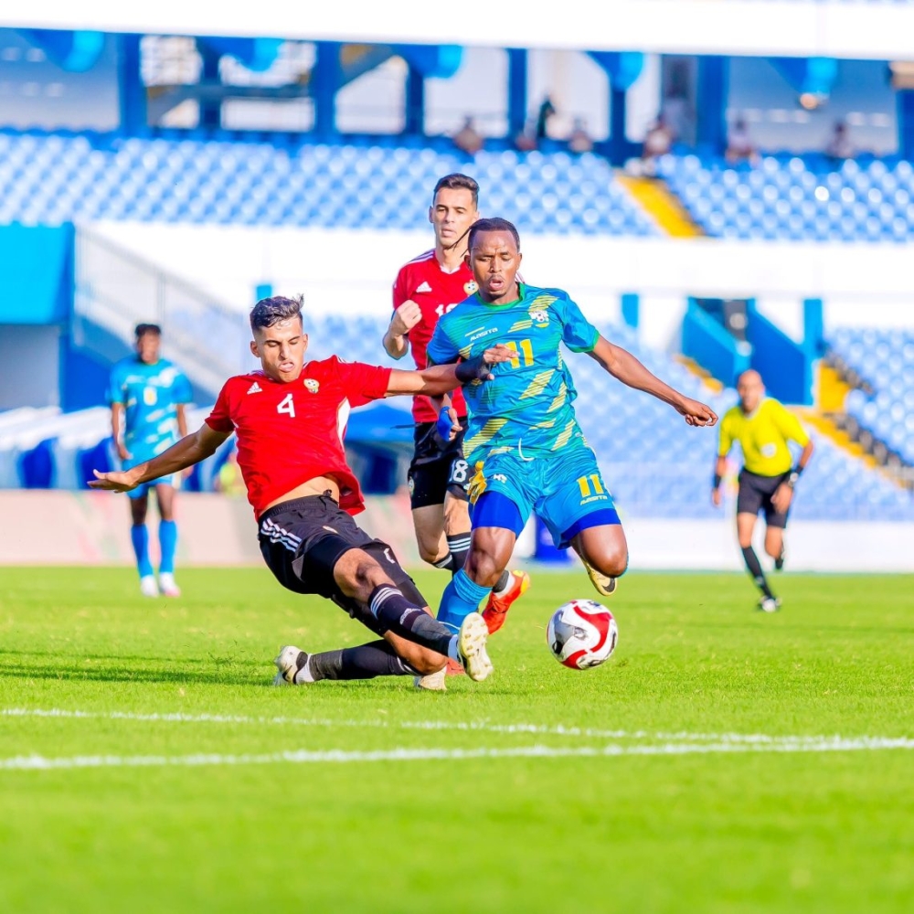 Libyan defender vies for ball against Rwandan midfielder Kevin Muhire during a past game. The two countries face off in the return leg at Amahoro Stadium on Thursday, November 14-courtesy