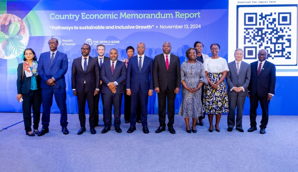 Prime Minister Edouard Ngirente poses for a group photo with other officials during the launch of the World Bank “Country Economic Memorandum Report” in Kigali, on Wednesday, November 13. Photo: Courtesy.