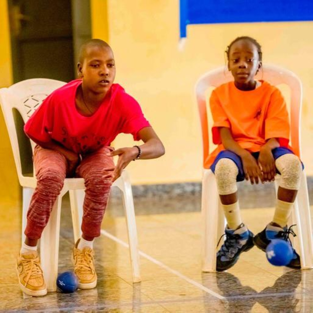 Two children with intellectual disabilities playing Boccia in Bugesera District-courtesy