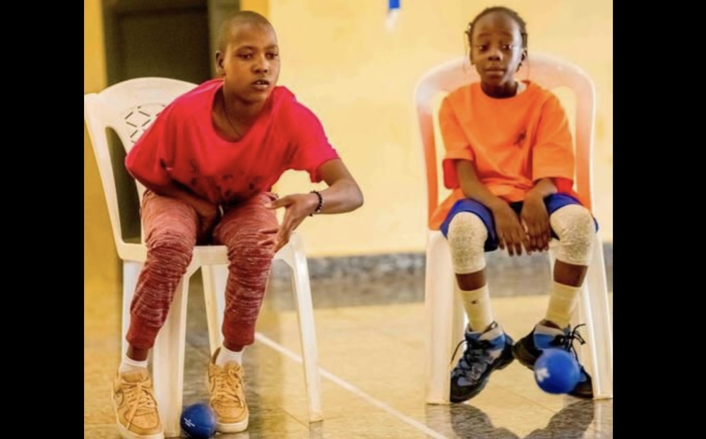 Two children with intellectual disabilities playing Boccia in Bugesera District-courtesy