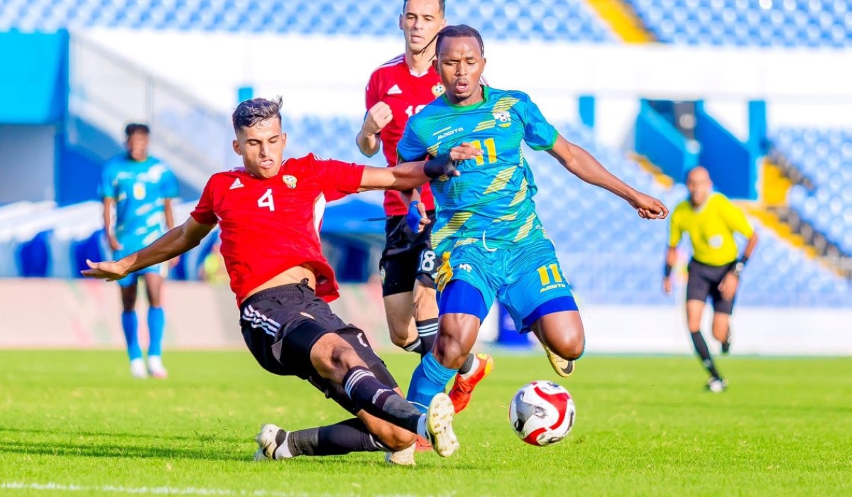 Libyan defender vies for ball against Rwandan midfielder Kevin Muhire during a past game. The two countries face off in the return leg at Amahoro Stadium on Thursday, November 14-courtesy