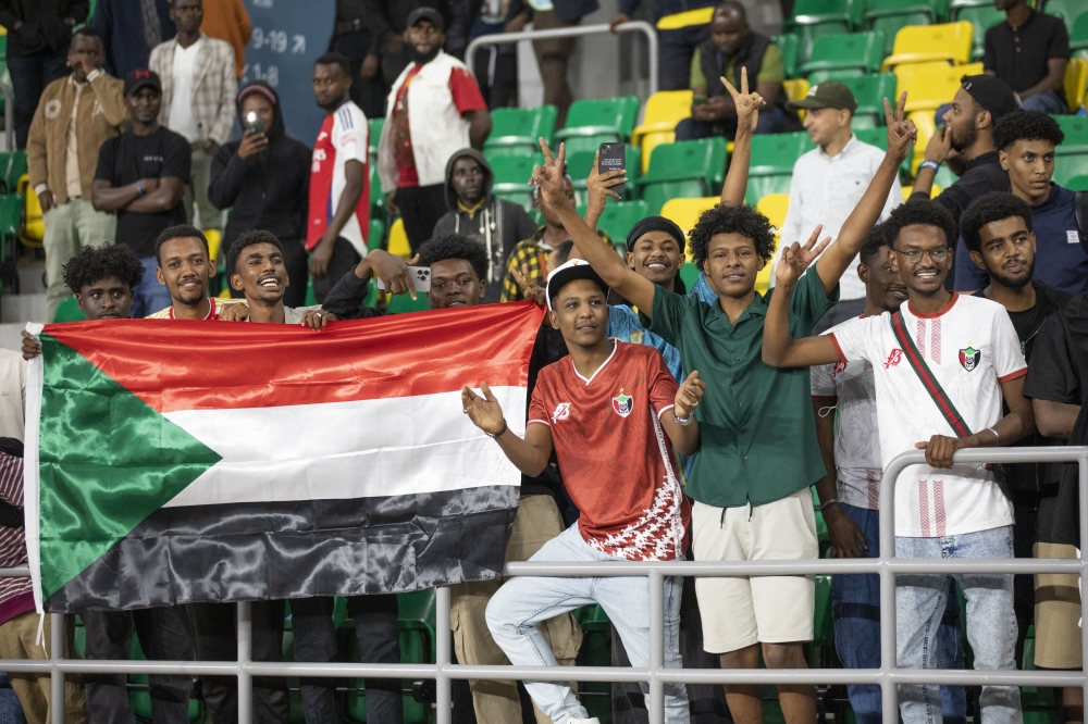 Traveling Libyan supporters cheer on their players after hard fought 1-0 victory against Rwanda in Kigali-Photo by Emmanuel Dushimimana