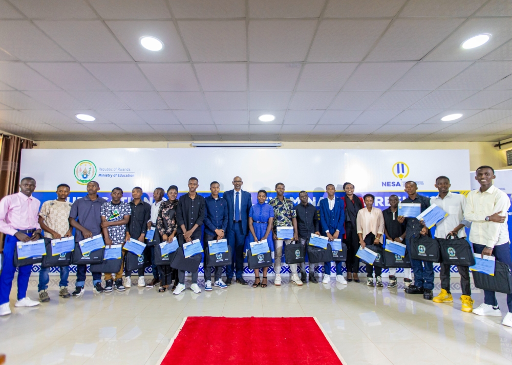 The top 18 performers from upcountry schools pose for a group photo with officials from the Ministry of Education during the release of Advanced Level (A-Level) examination results on November 15. Pho