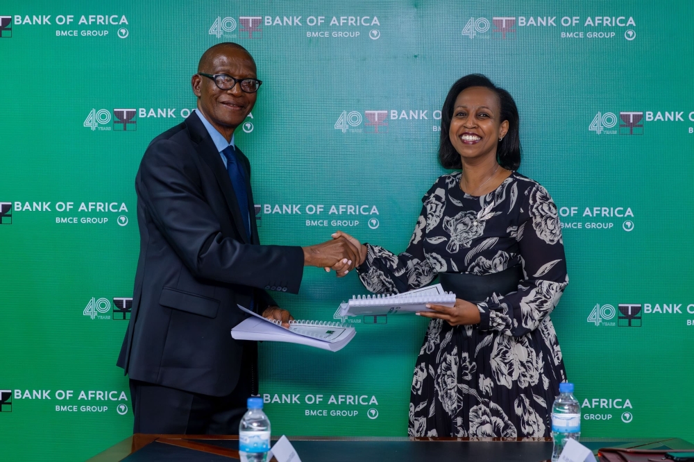 Emmanuel Ntaganda, the Chairperson of the Board of Directors at Bank of Africa, hands over the position to the newly appointed Chairperson, Betty Sayinzoga. in Kigali on November 15 Photo. Courtesy 