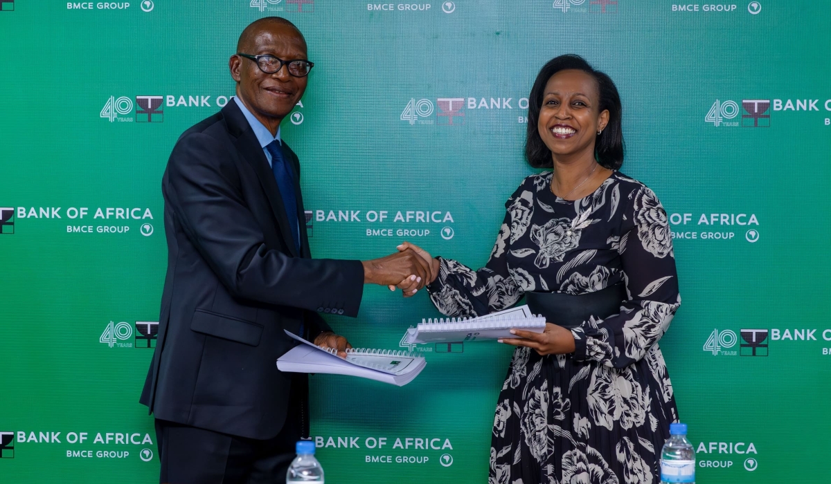 Emmanuel Ntaganda, the Chairperson of the Board of Directors at Bank of Africa, hands over the position to the newly appointed Chairperson, Betty Sayinzoga. in Kigali on November 15 Photo. Courtesy 