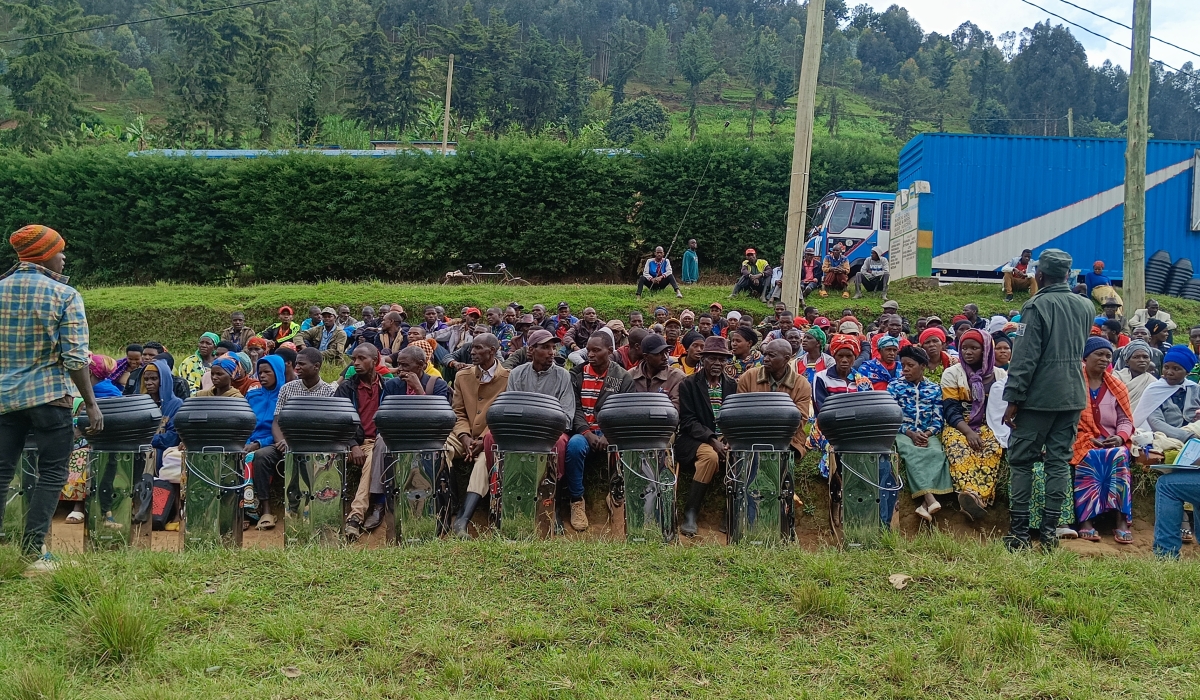 Residents of Burera District receive cookstoves as part of a programme meant to reduce their reliance on firewood from Rugezi wetland. Courtesy