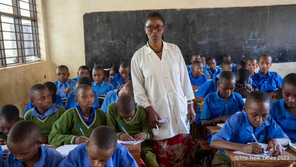  A primary school teacher gives a lesson to students at a Catholic primary school in the Gatsata sector, Gasabo District, in Kigali. Photos by Craish Bahizi