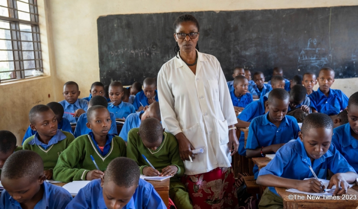  A primary school teacher gives a lesson to students at a Catholic primary school in the Gatsata sector, Gasabo District, in Kigali. Photos by Craish Bahizi